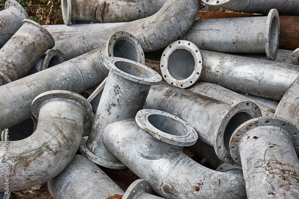 Old metal pipes in a pile