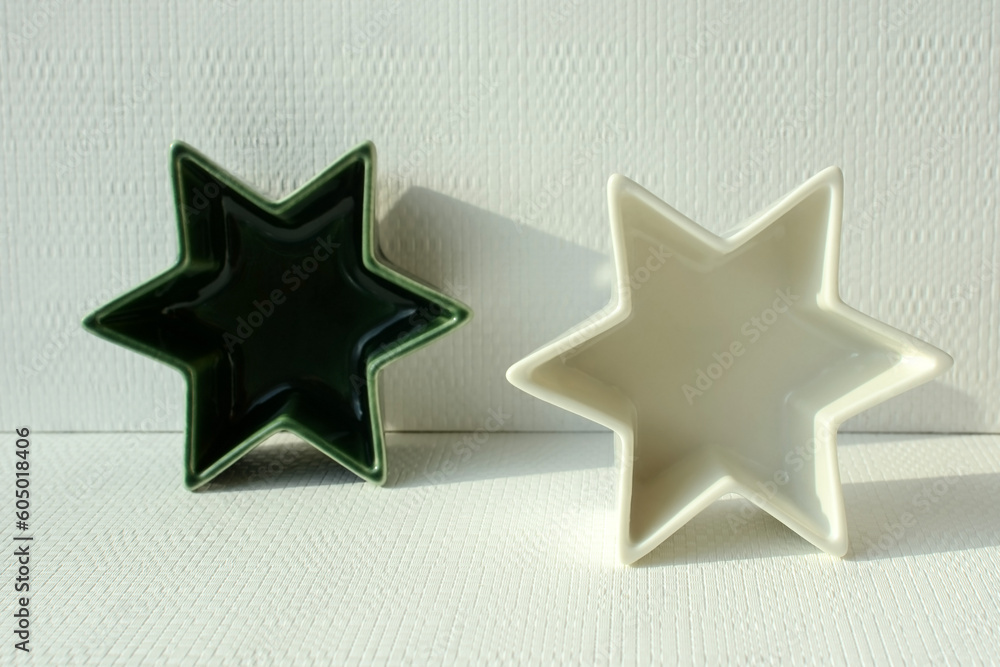 ceramic souvenir bowls in the shape of a star on a light background ceramic souvenir bowls in the shape of a star on a light background