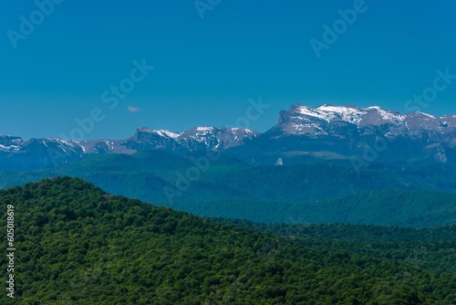 mountain peaks of the Main Caucasian Range from the side of the village of Bagovskaya (South of Russia) on a sunny summer day