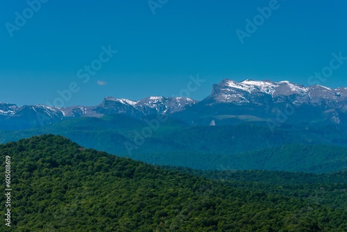 mountain peaks of the Main Caucasian Range from the side of the village of Bagovskaya (South of Russia) on a sunny summer day © Alexei Merinov