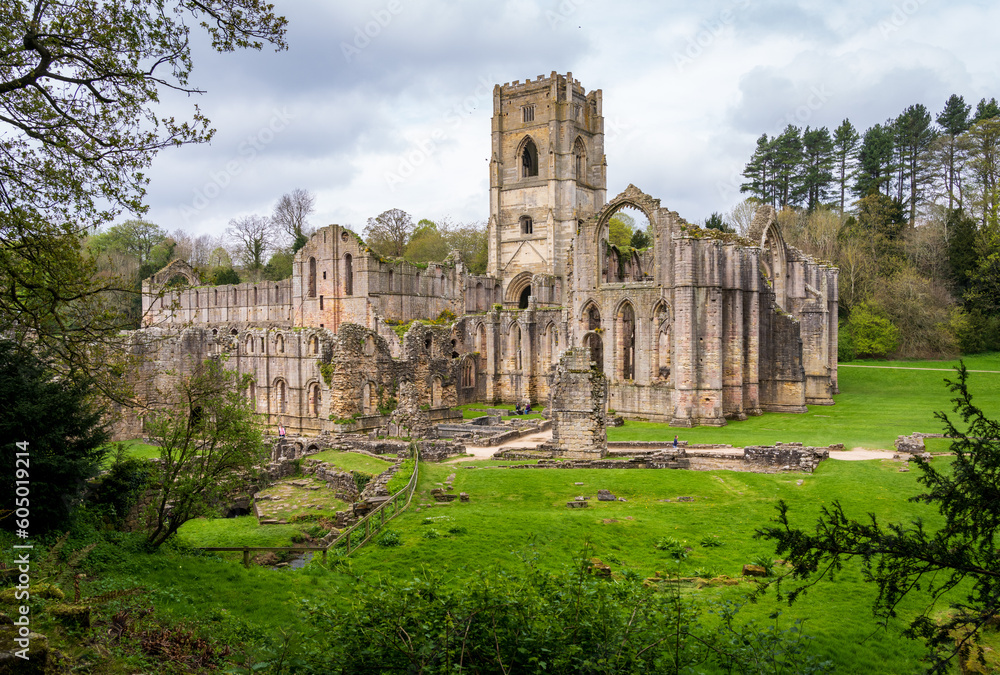 Fototapeta premium Detail of the ruins of Fountains Abbey in Yorkshire, United Kingdom in the spring as leaves start to appear