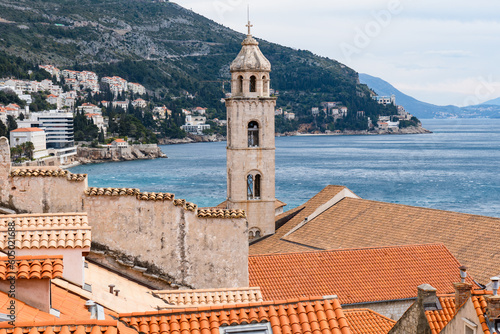 Old town of Dubrovnik, Croatia. Unesco heritage. View from the city wall to beautiful old church and Adriatic sea.