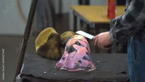 Craftsman Shaping a Ball of Molten Glass. Close Up.
