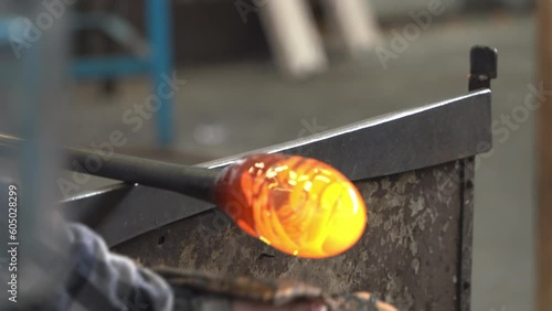 Craftsman Shaping a Ball of Molten Glass. Close Up.