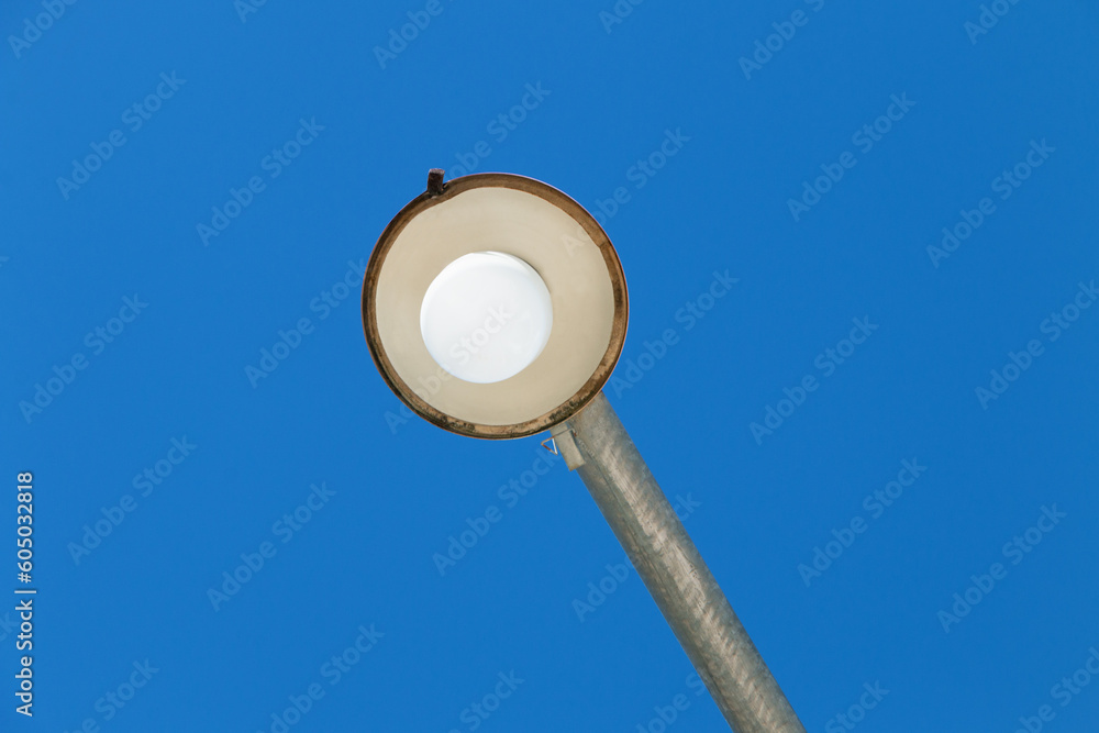 Public light seen from below with sky background. Public light seen from below with sky background.