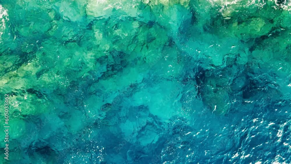 Top view of sea with crystal clear water. Water surface with calm waves Top view of sea with crystal clear water. Water surface with calm waves