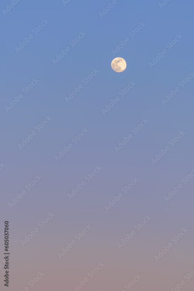 Full moon on the evening sky, closeup, can be used as natural background. Full moon on the evening sky, closeup, can be used as natural background.