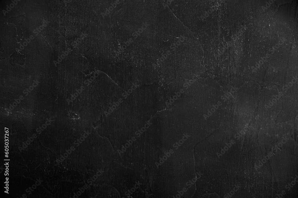 Fototapeta premium Chalk rubbed out on blackboard. Chalkboard background.Black stone background. Black texture of cement. Copy sapce.Dark grey slate.