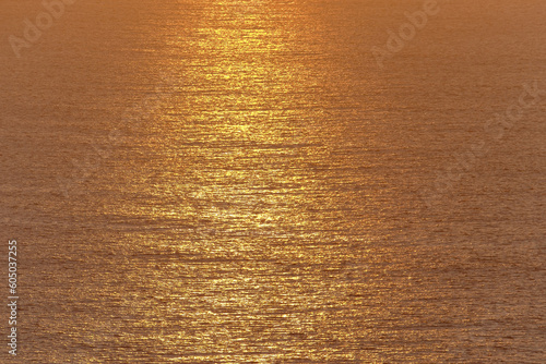 Background with sea water at sunset.