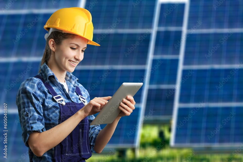 Professional engineer with solar panels background Professional engineer with solar panels background