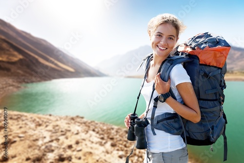 Happy young woman while out hiking.