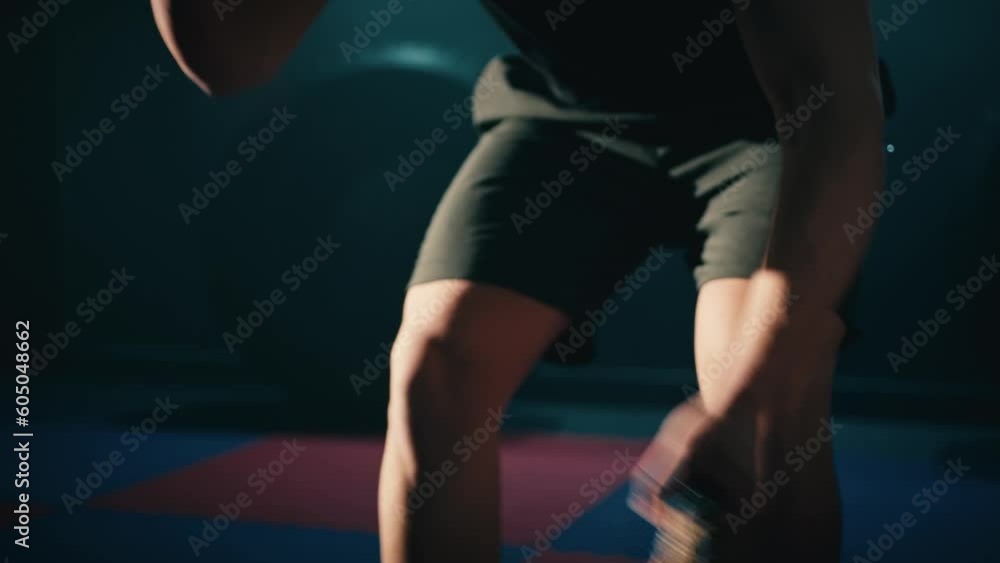 Fitness athlete training using battle ropes intense workout Fitness athlete training using battle ropes intense workout