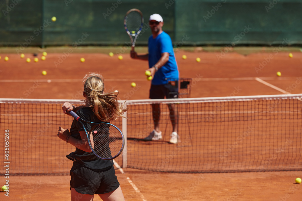 A professional tennis player and her coach training on a sunny day at the tennis court. Training and preparation of a professional tennis player