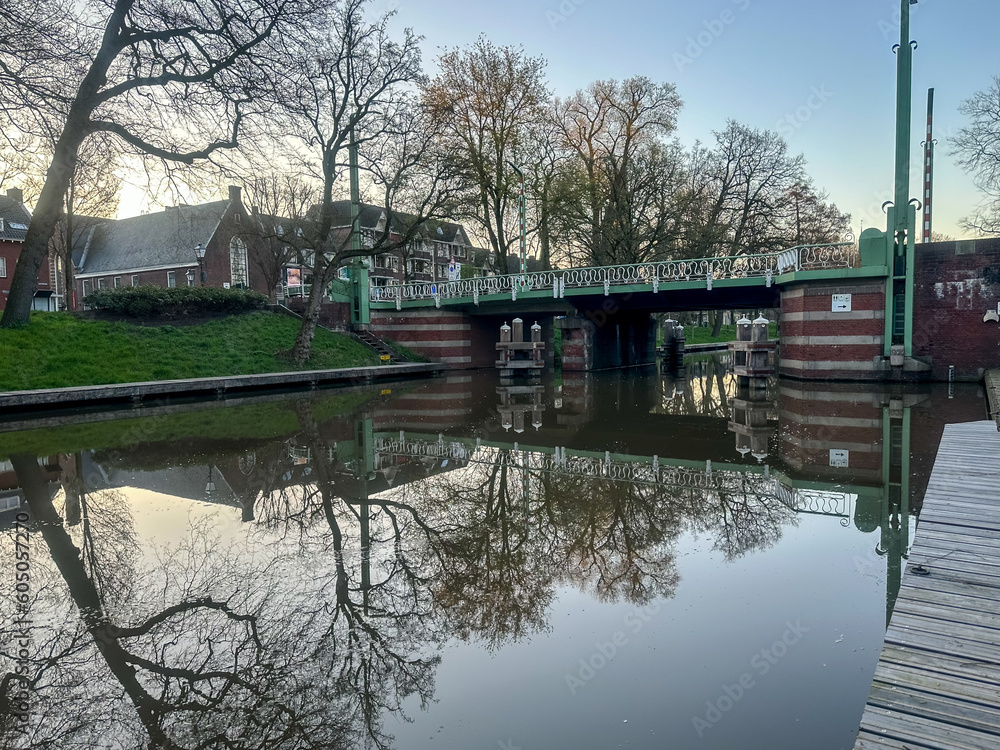 Utrecht, Netherlands - April 2, 2023: Landscapes along a tree lined canal in Utrecht Utrecht, Netherlands - April 2, 2023: Landscapes along a tree lined canal in Utrecht