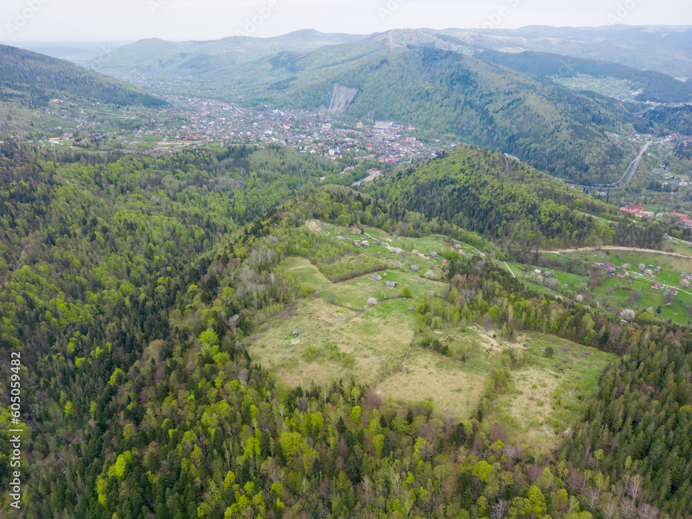 An aerial view of the mountain Yaremche town from above, green Carpathian mountains