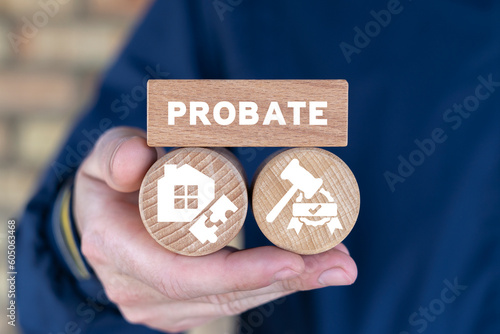 Lawyer holding wooden blocks and sees text: PROBATE. Concept of Legal Legacy. Probate Wealth House Estate. Inheritance of property by court decision.