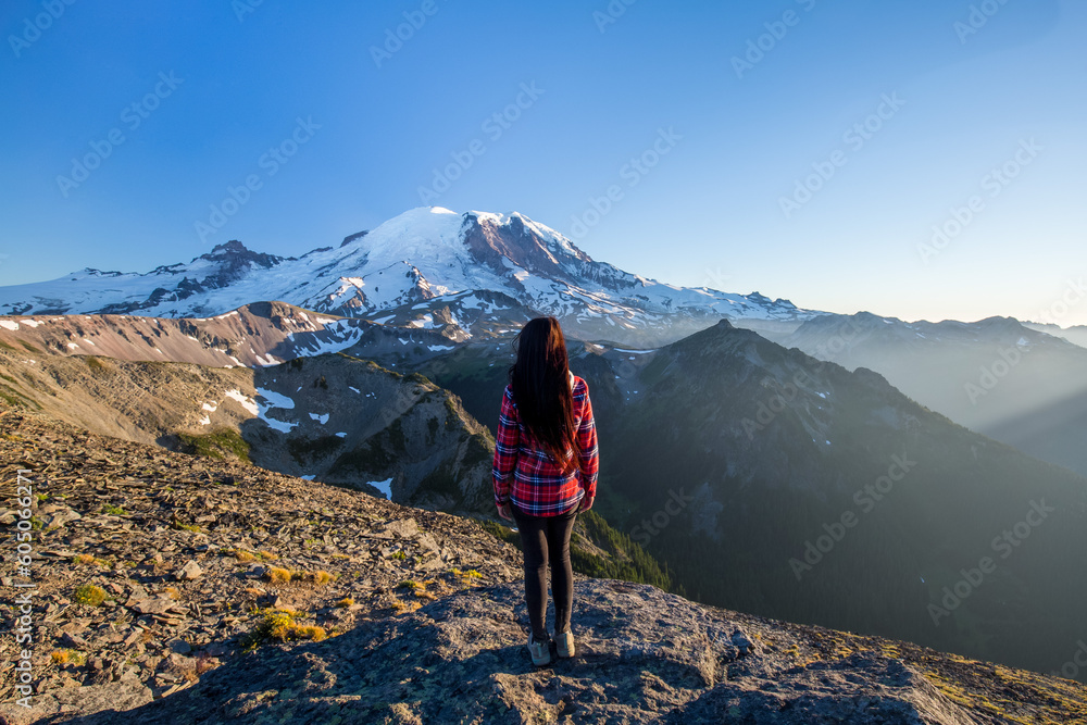 Girl on the top of Mount Fremont with Mount Rainier on the background