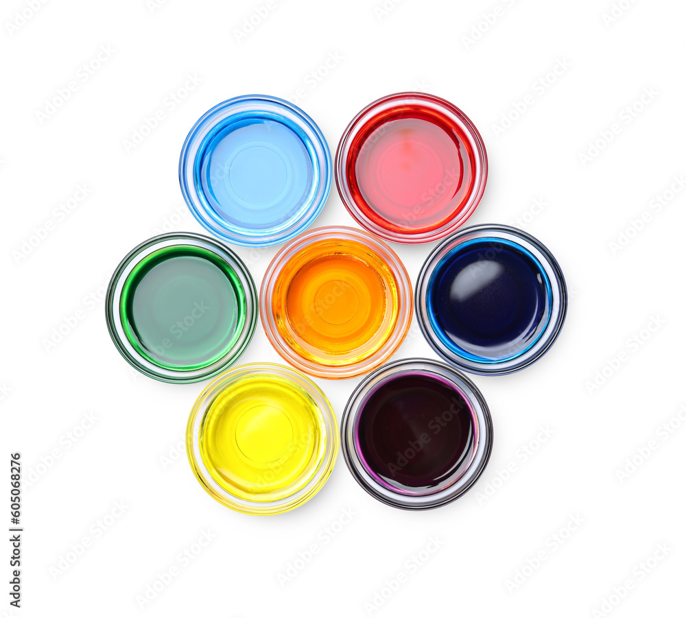Glass bowls with different food coloring on white background, top view Glass bowls with different food coloring on white background, top view