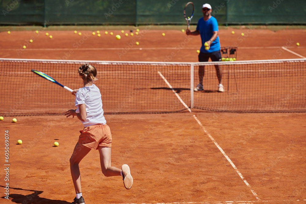 A professional tennis player and her coach training on a sunny day at the tennis court. Training and preparation of a professional tennis player