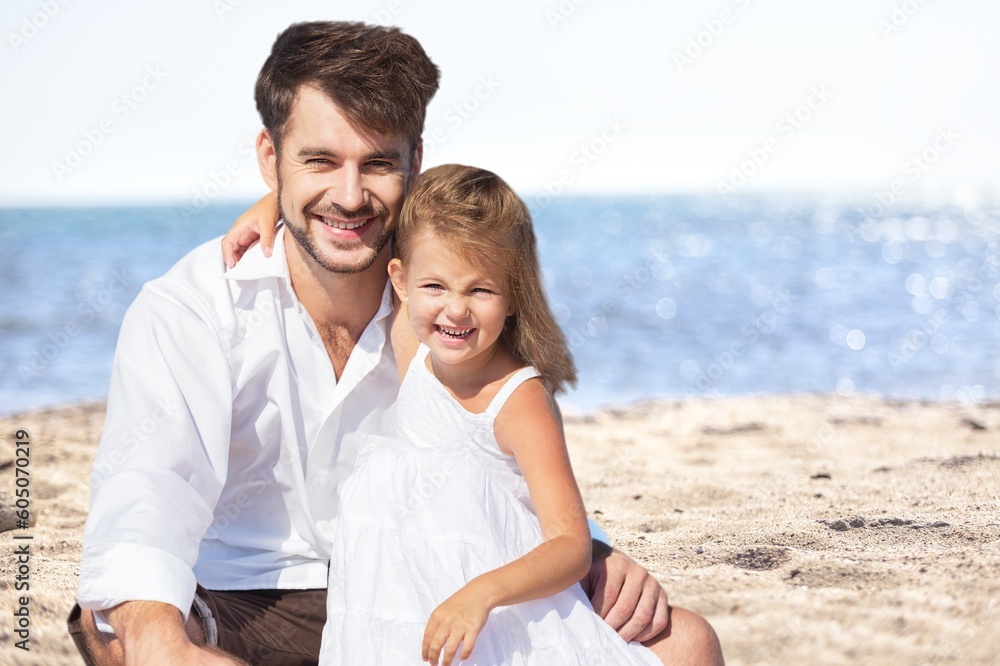 Happy young family having fun in vacation on beach Happy young family having fun in vacation on beach