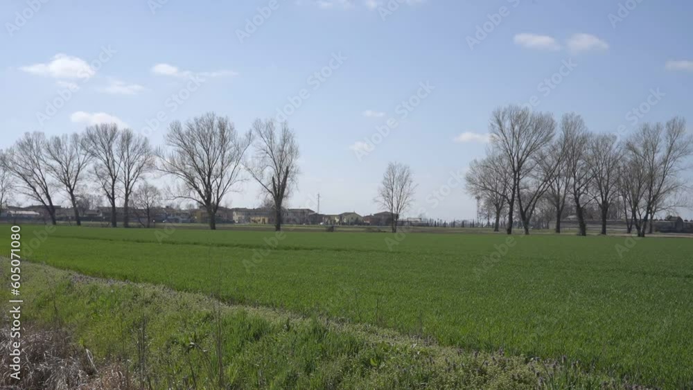 Plain countryside with a small town in the background, slow motion Plain countryside with a small town in the background, slow motion