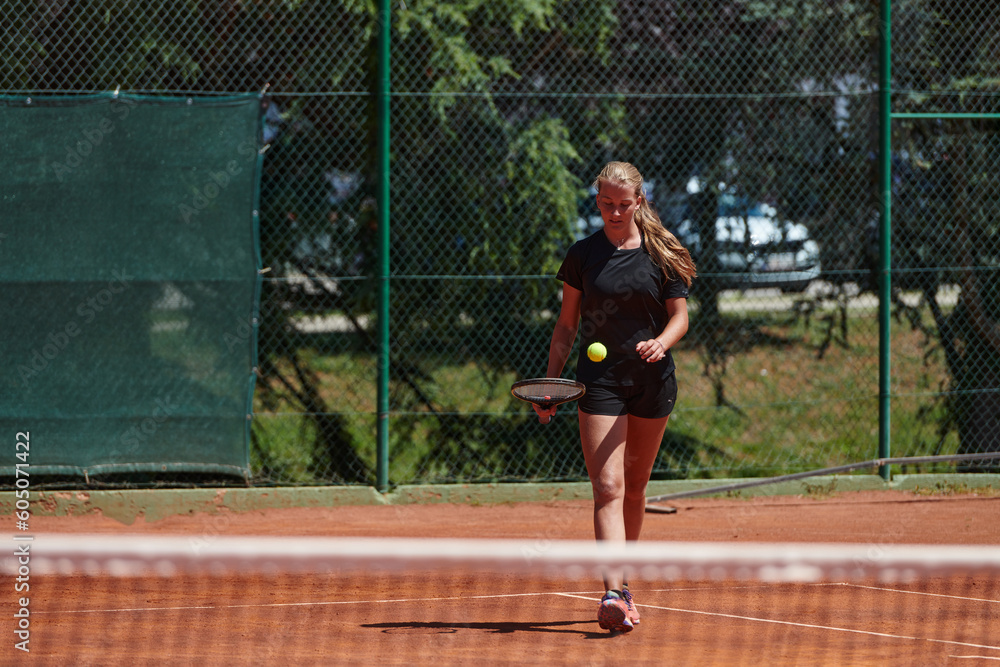 A young girl showing professional tennis skills in a competitive match on a sunny day, surrounded by the modern aesthetics of a tennis court. A young girl showing professional tennis skills in a competitive match on a sunny day, surrounded by the modern aesthetics of a tennis court.