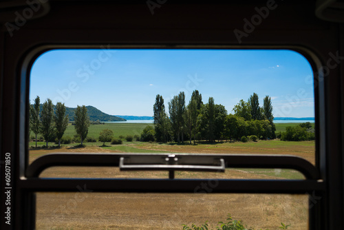 Canvas Print View from an old train to lake Balaton on a summer day, Go to a vacation, school