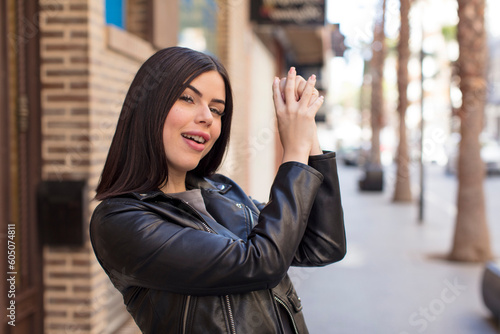 Wallpaper Mural young pretty woman feeling happy, surprised and proud, shouting and celebrating success with a big smile Torontodigital.ca