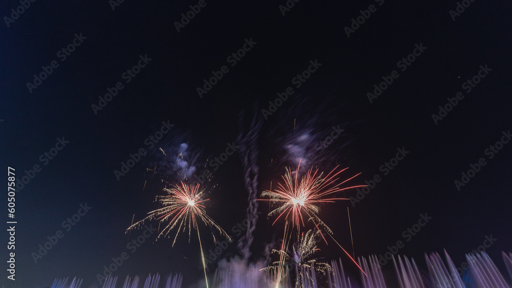 fireworks on a black background Frame or border from golden sparks and firecrackers isolated on new year night fireworks and bokeh lights on dark blue night sky background.
