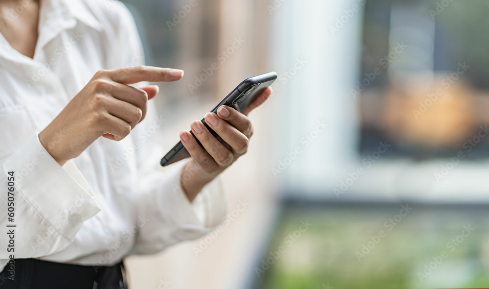 woman's hand with mobile phone Young woman tapping finger on blank screen of smartphone to click line and play social media online shopping job. woman's hand with mobile phone Young woman tapping finger on blank screen of smartphone to click line and play social media online shopping job.