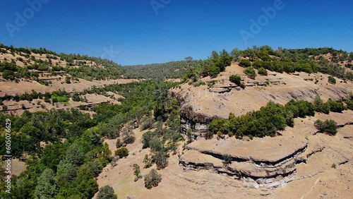 Aerial cinematic drone calvary cross Richard Springs YWAM Chico California Upper Bidwell Park butte cave creek canyon three cross on hillside crucifixion place of skull mid day sunny backward motion photo