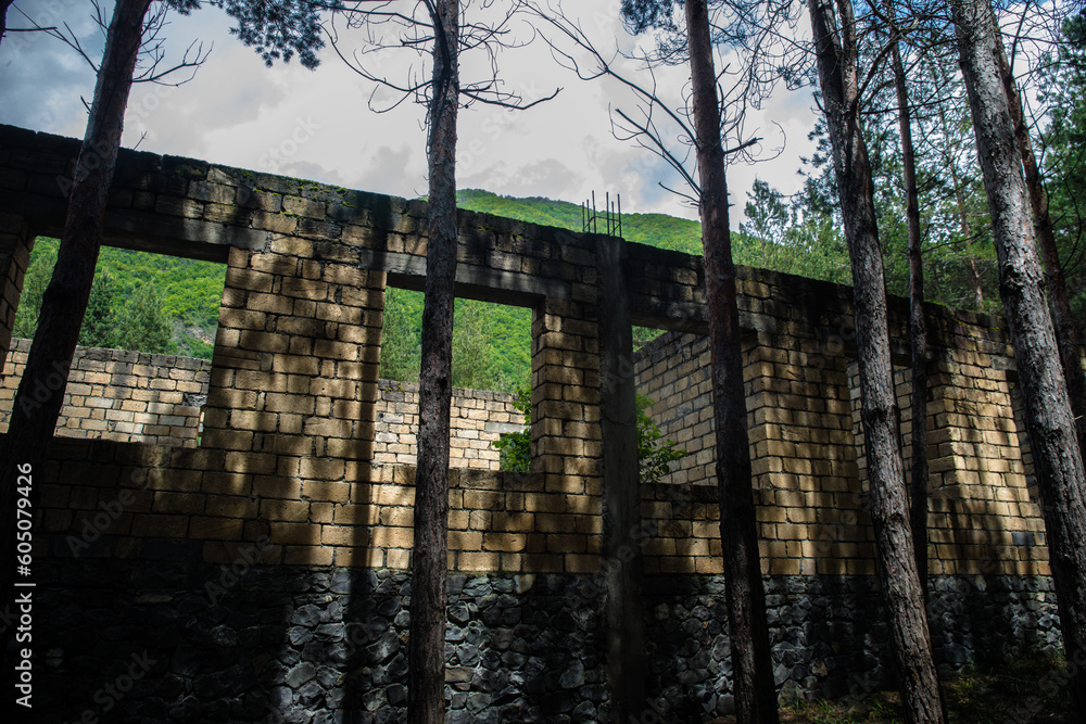 Old abandoned building in forest, Facade ruins of industrial factory. Old abandoned building in forest, Facade ruins of industrial factory.