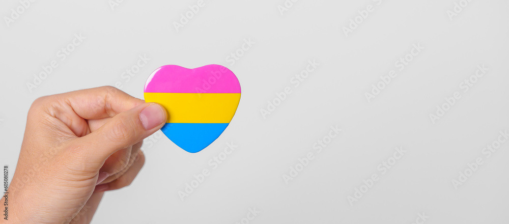 pansexual-pride-day-and-lgbt-pride-month-concept-hand-holding-pink