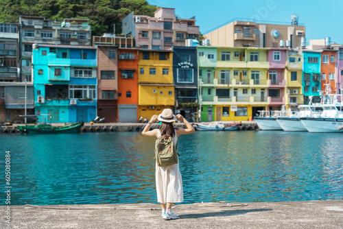 Fototapeta woman traveler visiting in Taiwan, Tourist with backpack and hat sightseeing in Keelung, Colorful Zhengbin Fishing Port, landmark and popular attractions near Taipei city