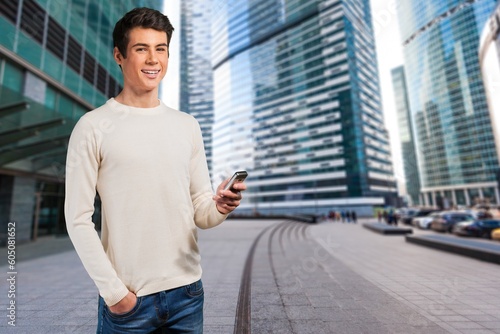 Young happy business man with phone on outdoor Free Download Young happy business man with phone on outdoor - GFXLoad