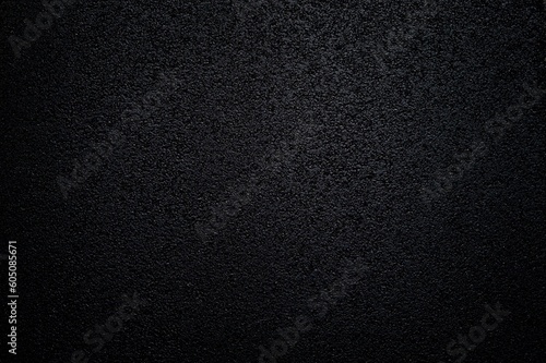 Dark background with asphalt surface texture photo