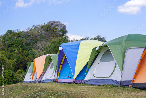 camping tent on the top of the mountain in winter in northern Thailand, view of trees, sky and clouds in clear air. Soft and selective focus.  © Aoy_Charin