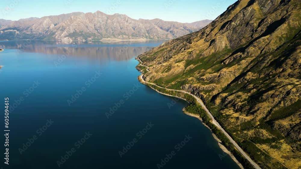 Aerial of the scenic road along Lake Wanaka in the South Island, New Zealand. Drone dolly forward Aerial of the scenic road along Lake Wanaka in the South Island, New Zealand. Drone dolly forward