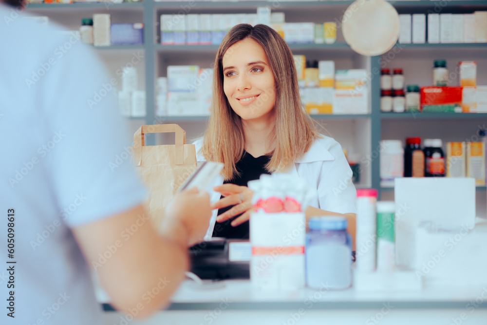 Customer Paying at the Pharmacy using Credit Card Method of Payment. Happy pharmacist assisting a patient to make pharmaceutical purchase
Customer Paying at the Pharmacy using Credit Card Method of Payment. Happy pharmacist assisting a patient to make pharmaceutical purchase