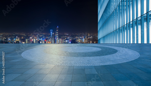 Leinwand Poster Empty square floor and city skyline with modern building at night in Shanghai, China