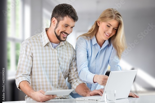 Business people looking something in laptop computer