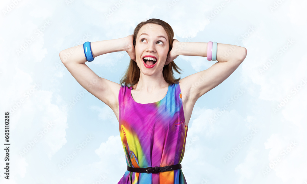 Redhead beautiful girl closing her ears with hands Redhead beautiful girl closing her ears with hands