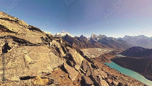 360 VR Gokyo Ri mountain top. Tibetan prayer Buddhist flag. Wild Himalayas high altitude nature and mount valley. Rocky slopes covered with snow. Panorama camera movement.