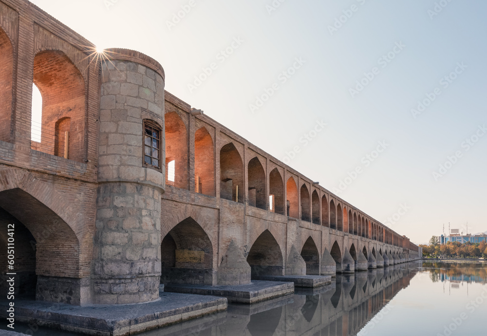 Si-o-Se Pol (Bridge of 33 Arches or Allahverdi Khan Bridge) on Zayanderud River in Isfahan, Iran. Architectural masterpiece and historical heritage. Tourist attraction.