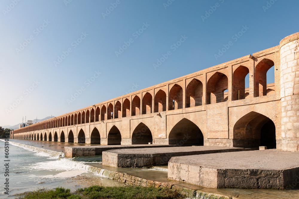 Si-o-Se Pol (Bridge of 33 Arches or Allahverdi Khan Bridge) on Zayanderud River in Isfahan, Iran. Architectural masterpiece and historical heritage. Tourist attraction.