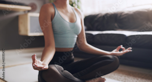 Yoga, lotus and hands of woman on living room floor for breath, exercise or zen in her home. Inner peace, meditation and female person relax while meditating for healing, balance or wellness training