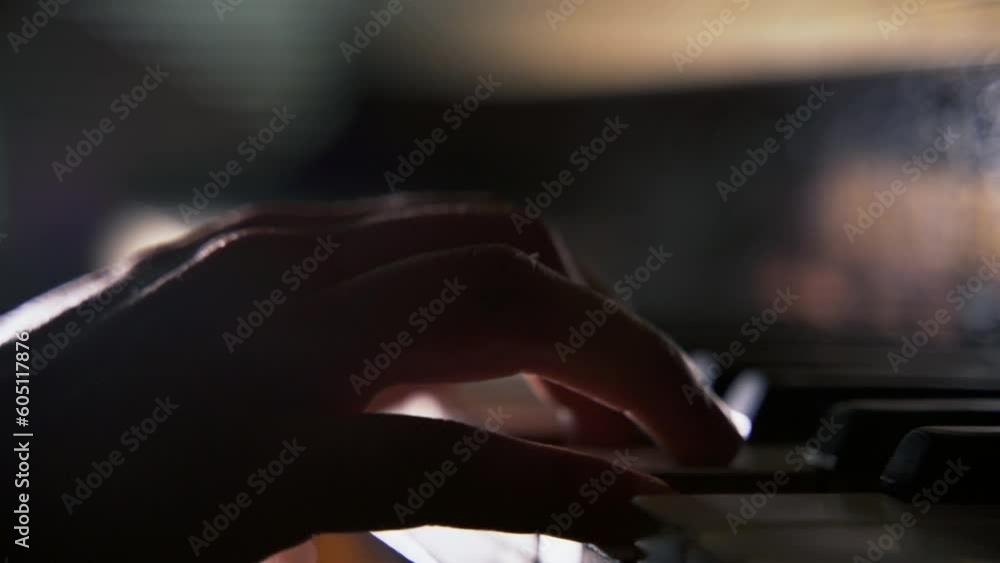 Close-up hands of unrecognizable musician male pianist playing classics music on piano in concert hall. Close up side view of man music composer practicing piano. Shooting in slow motion Close-up hands of unrecognizable musician male pianist playing classics music on piano in concert hall. Close up side view of man music composer practicing piano. Shooting in slow motion