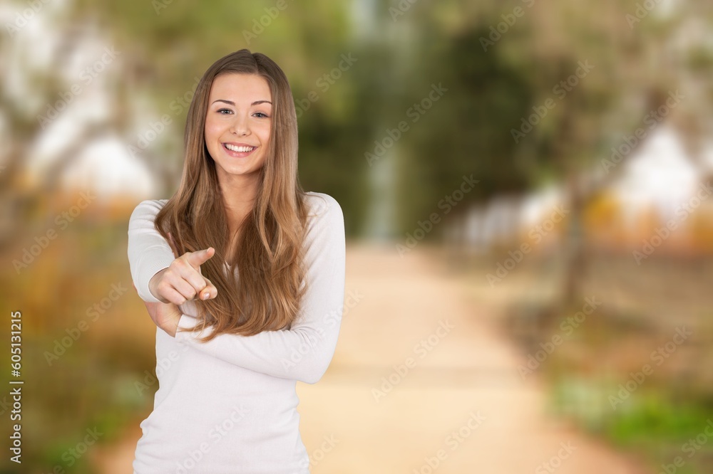 Happy Woman posing on nature background Happy Woman posing on nature background