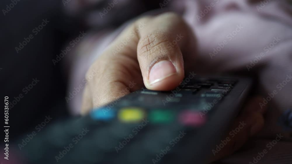 close up of women hand holding tv remote. close up of women hand holding tv remote.