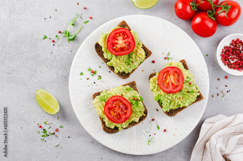 Avocado Toasts with Tomato, Healthy Snack or Breakfast on Bright Background